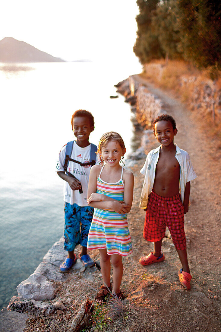 Children on the path along the bay near Hotel Sipan, Sipanska Luka, Sipan island, Elaphiti Islands, northwest of Dubrovnik, Croatia