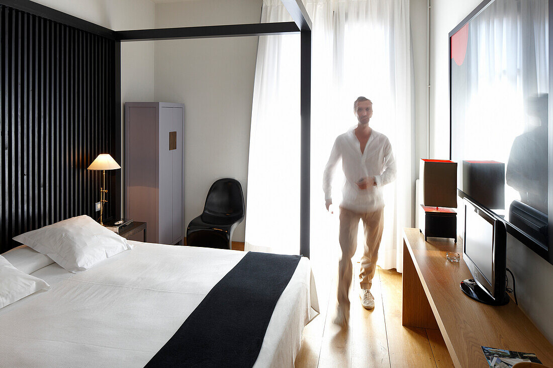 Man in a hotel room, Barcelona, Catalonia, Spain