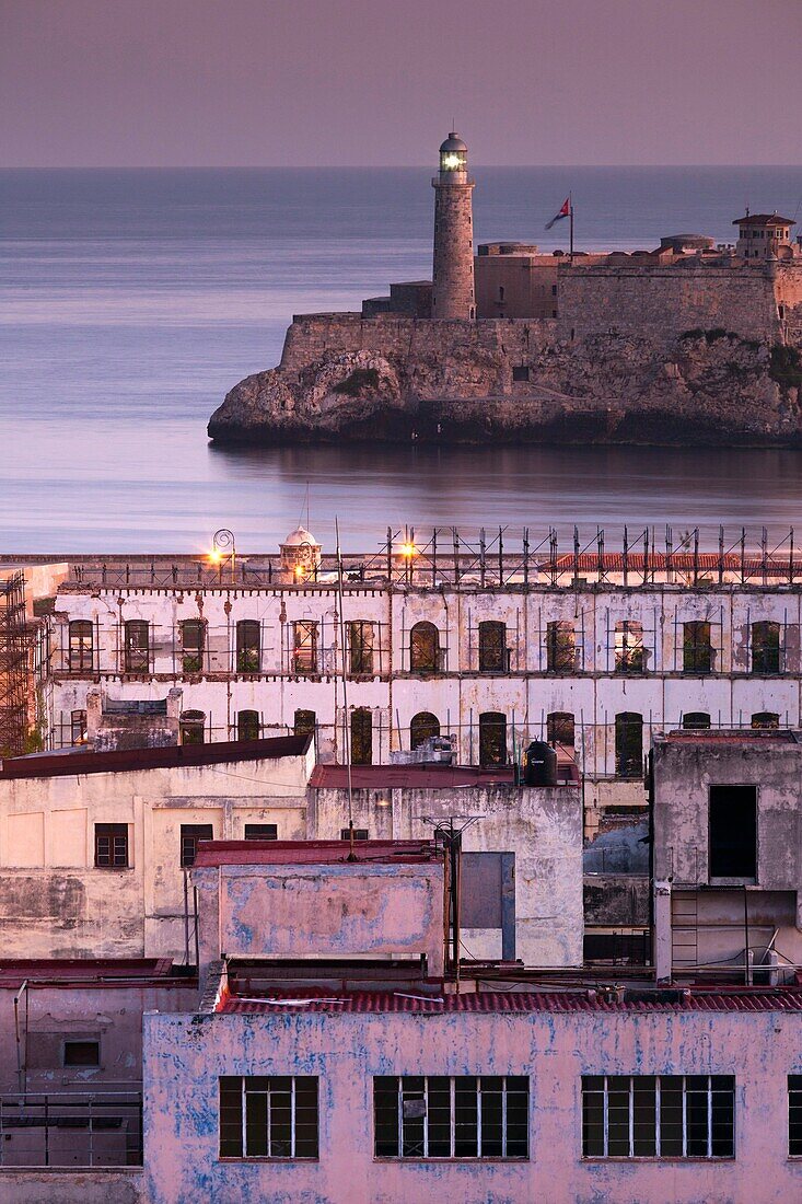 Cuba, Havana, elevated city view above Paseo de Marti towards Castillo de los Tres Santos Reyes del Morro, dawn