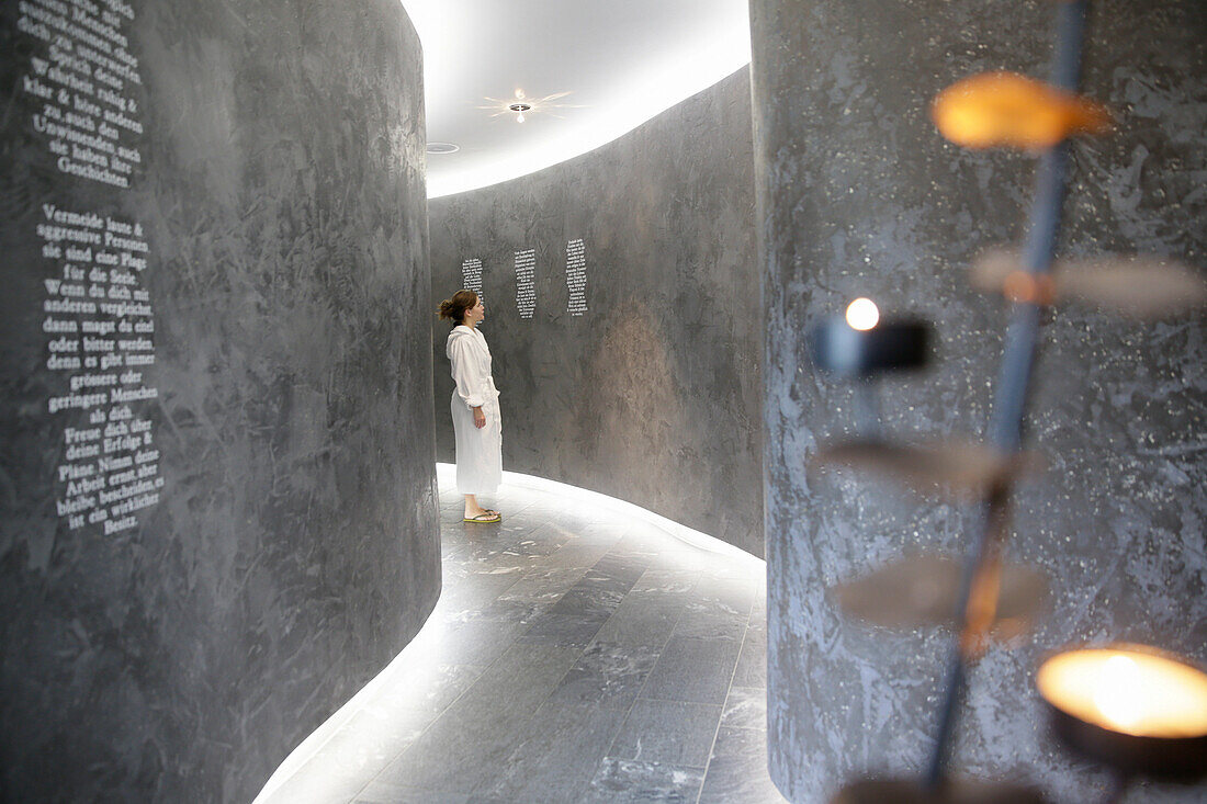 Woman wearing bathrobe in hotel spa area, Tannheim, Tannheim Valley, Tyrol, Austria