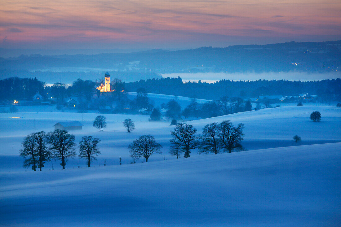 View to Holzhausen with parish church of St. John the Baptist in twilight, Holzhausen, Munsing, Bavaria, Germany