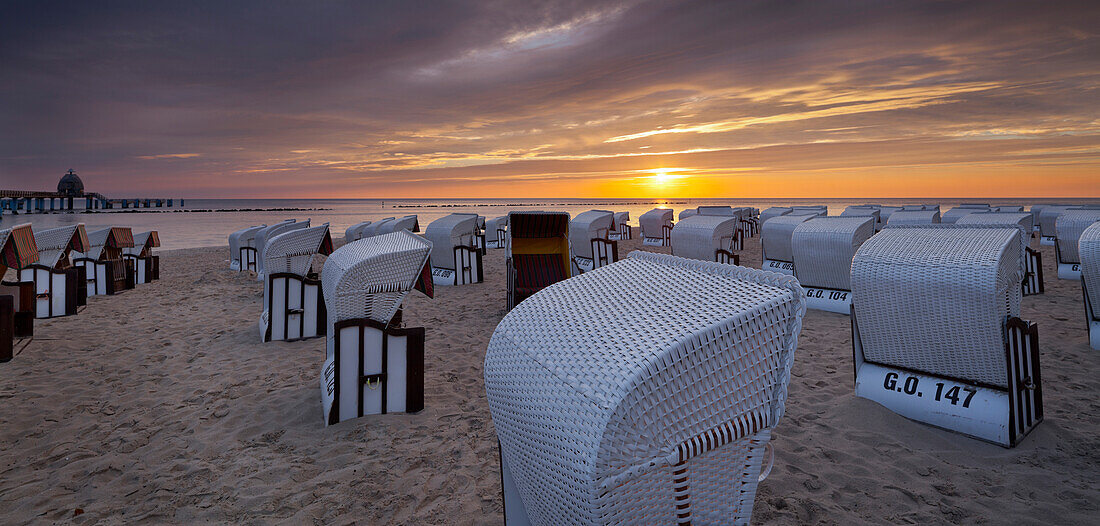 Hooded beach chairs near Sellin pier in the morning light, Ruegen, Mecklenburg-Western Pomerania, Germany