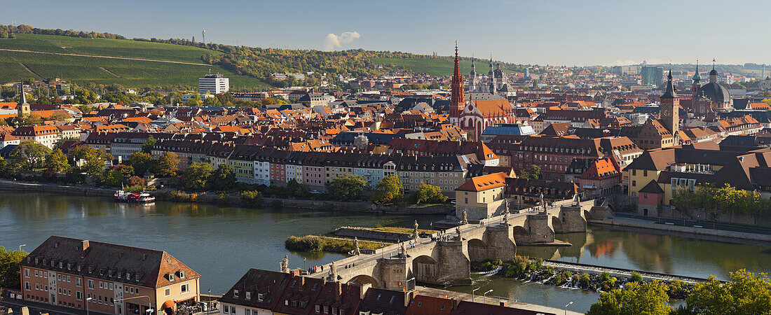 View from Marienberg fortress over Wuerzburg, Alte Mainbruecke bridge and river Main, Neumuenster Kollegiatstift, St Kilian's cathedral, Wuerzburg, Bavaria, Germany