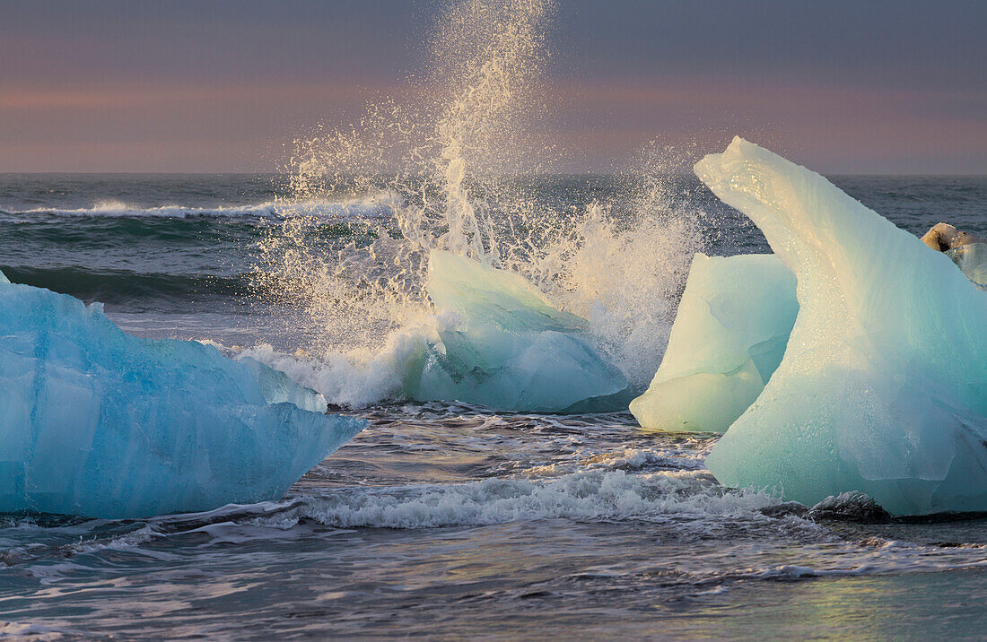 Icebergs in the waves in the glacial lake, Jokulsarlon, East Iceland, Iceland