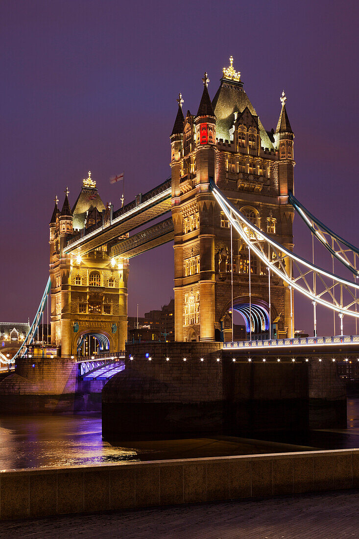 Tower Bridge with lights at night, London, England