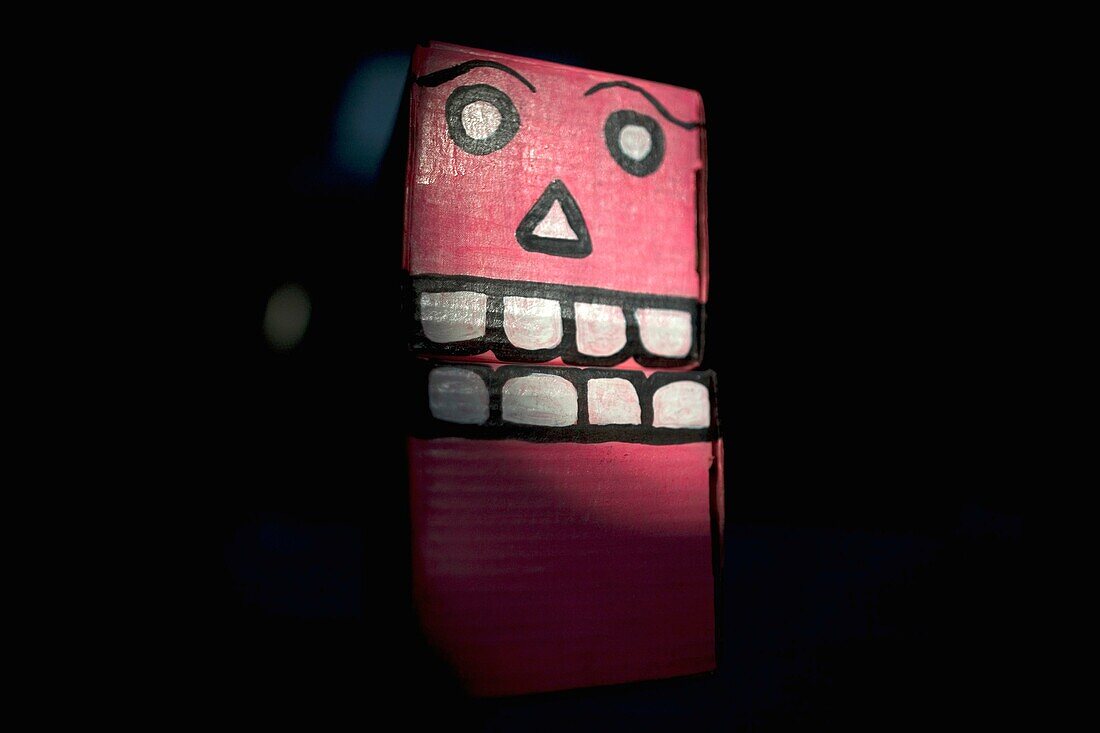 A box painted to be used as a decoration for the Day of the Dead is displayed in a Mexican folk-art workshop in Mexico City, Mexico