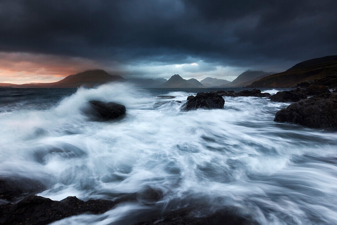 Rampaging surf at the beach of Elgol with the view to Cuillin Hills on the Isle of Skye, Scotland, United Kingdom