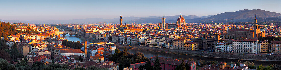View from Piazzale Michelangelo showing the Arno Valley and Florence with the cathedral Santa Maria del Fiore and the Palazzo Vecchio in the morning sunlight, Tuscany, Italy