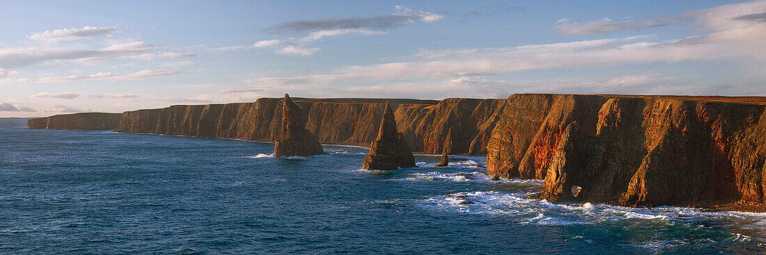 Impressive panorama from Duncansby Head on the northeast coast of Scotland to the wild cliffs and the Duncansby Stacks, United Kingdom