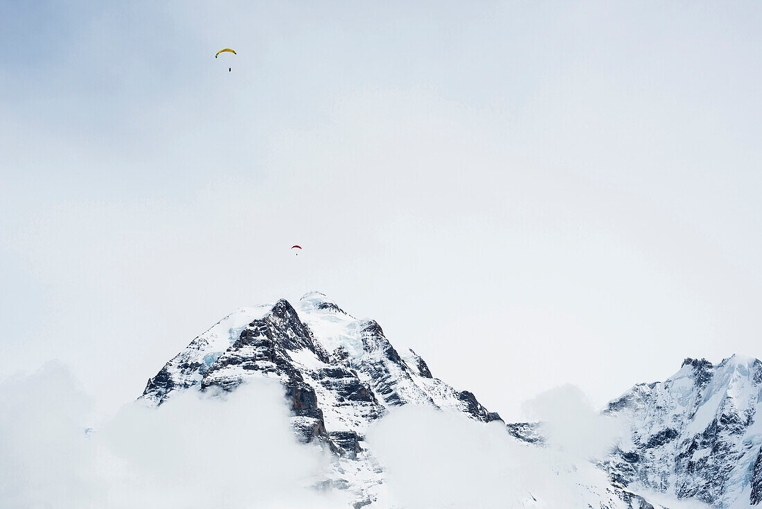 Paragliders near Jungfrau mountain, Muerren, canton of Bern, Switzerland