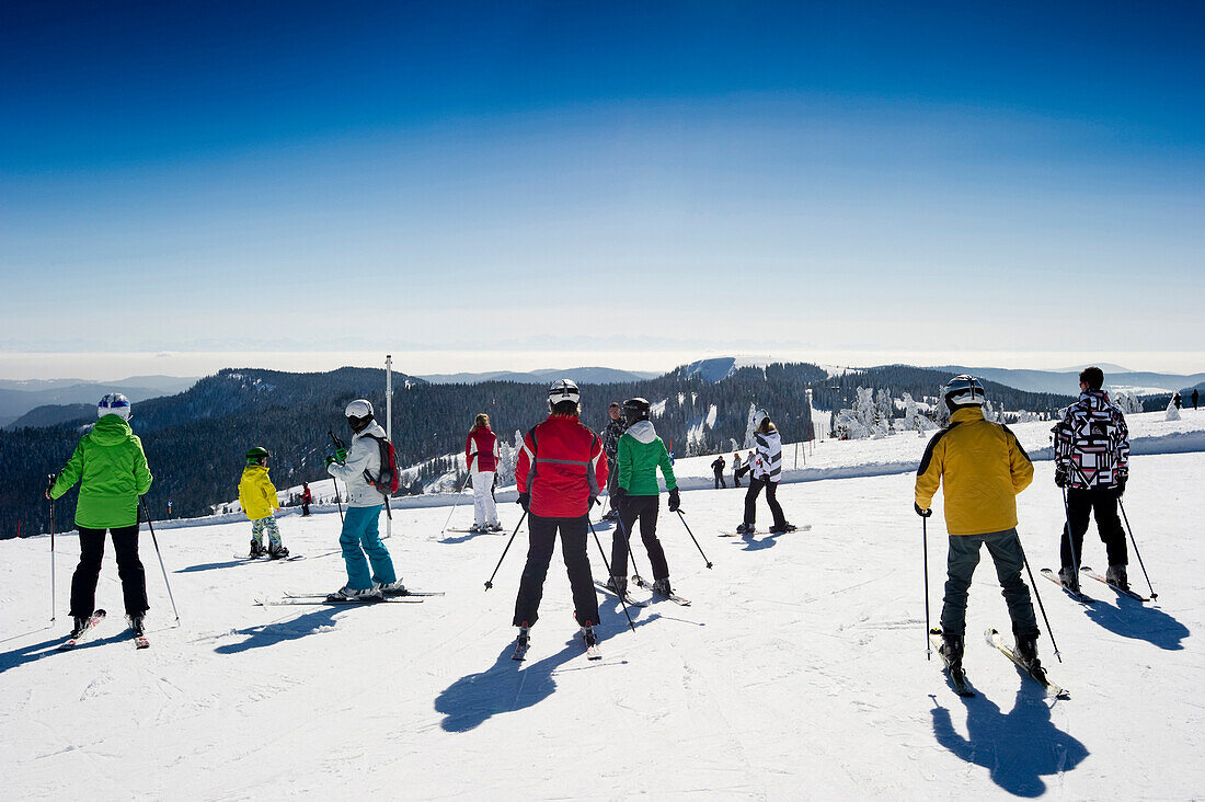 Skiers on the summit of Feldberg, Black Forest, Baden-Wuerttemberg, Germany