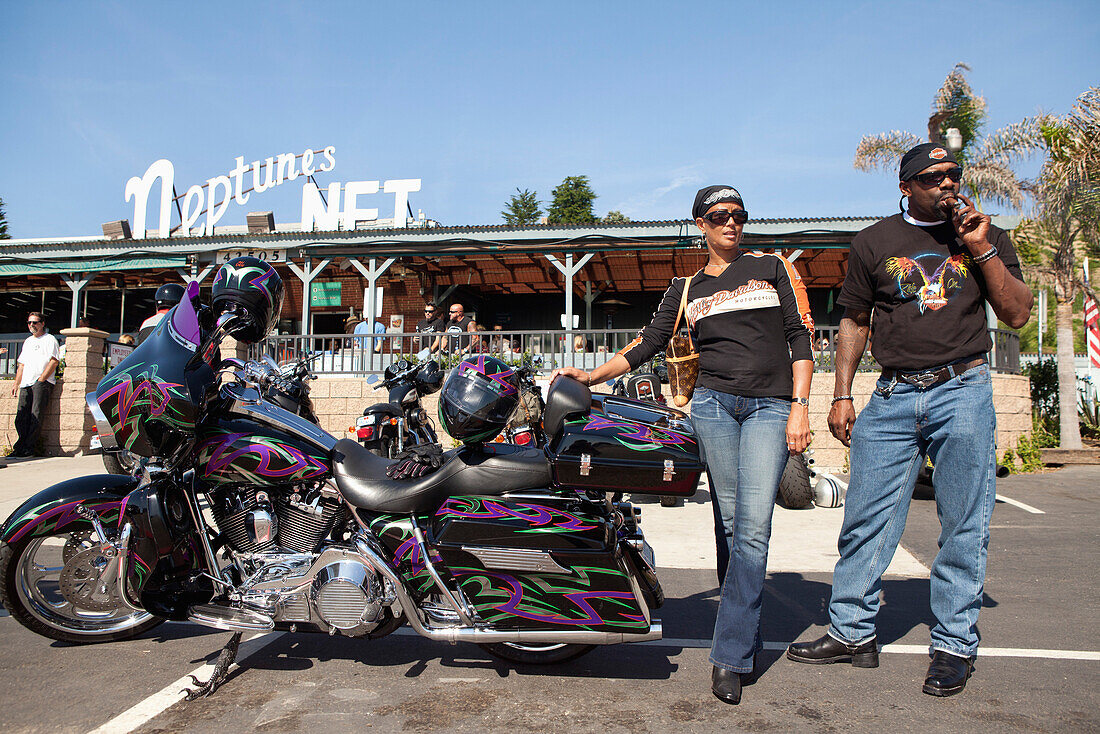USA, California, Malibu, bikers stand in front of Neptunes Net Restaurant on the Pacific Coast Highway