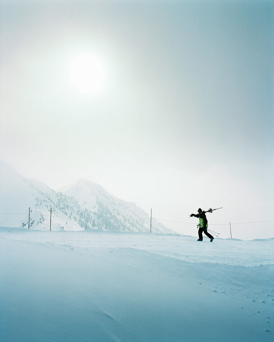 CANADA, skier walking with skiis at the top of the mountain, Kicking Horse Ski Resort
