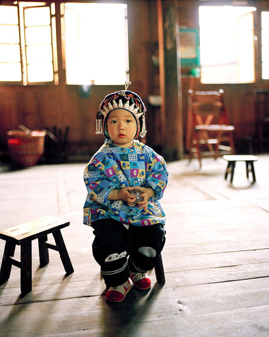 CHINA, portrait of young girl in traditional clothing, Longsheng