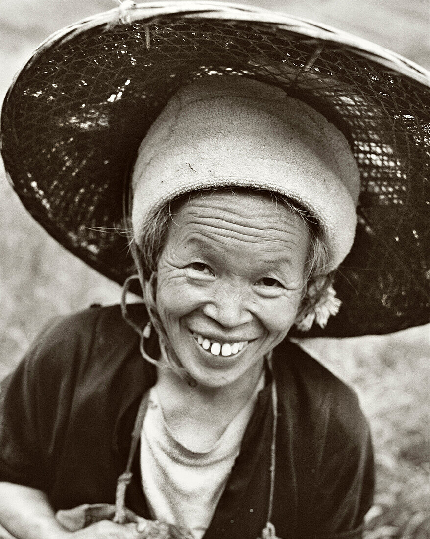 CHINA, portrait of Rice Farmer, smiling senior woman (B&W)