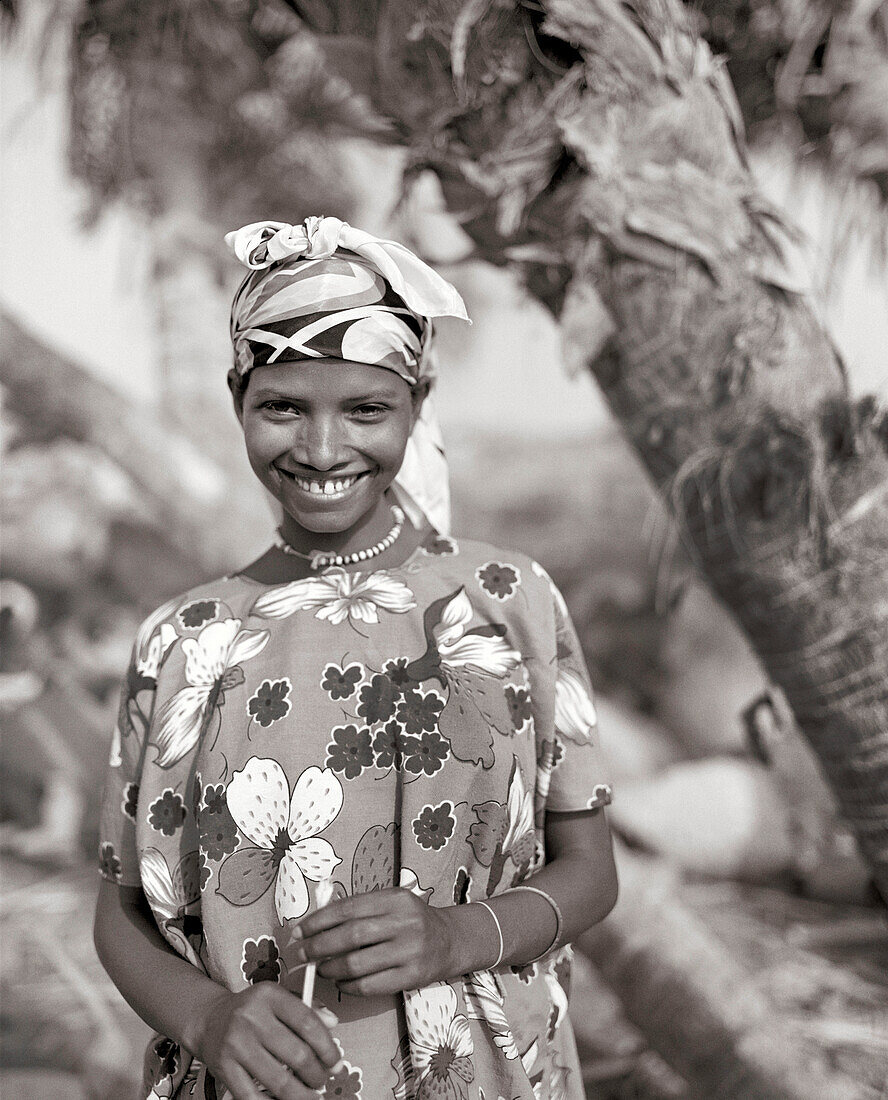 ERITREA, Beilul, a young Afar girl tends to her livestock in Dad Village (B&W)