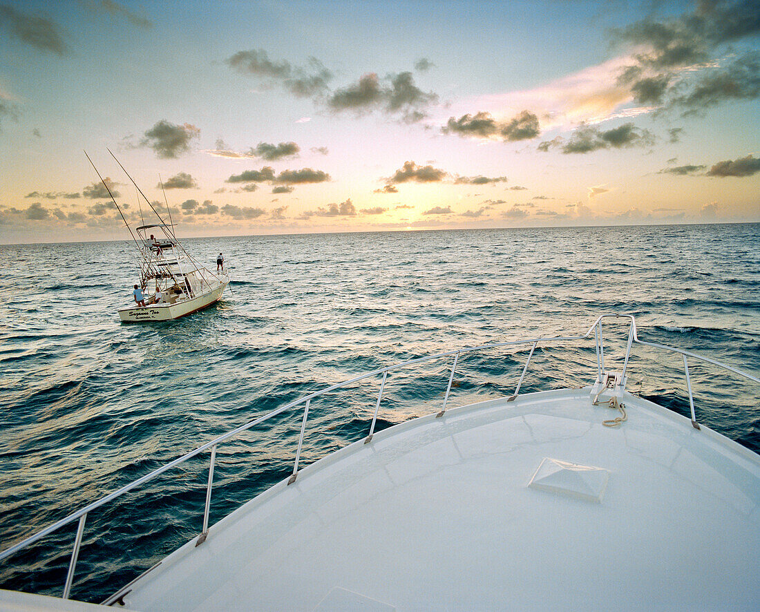 USA, Florida, fishing boats on sea at sunrise, Islamorada