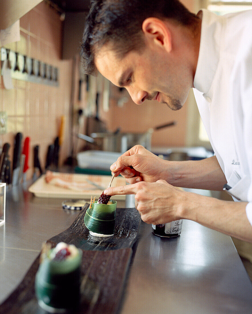 FRANCE, Burgundy, chef preparing food in restaurant, Le Charlemagne