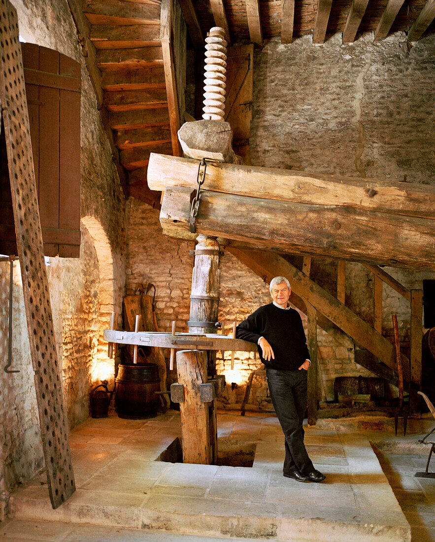 FRANCE, Burgundy, Michael Laroche in his old grape pressing room, Chablis