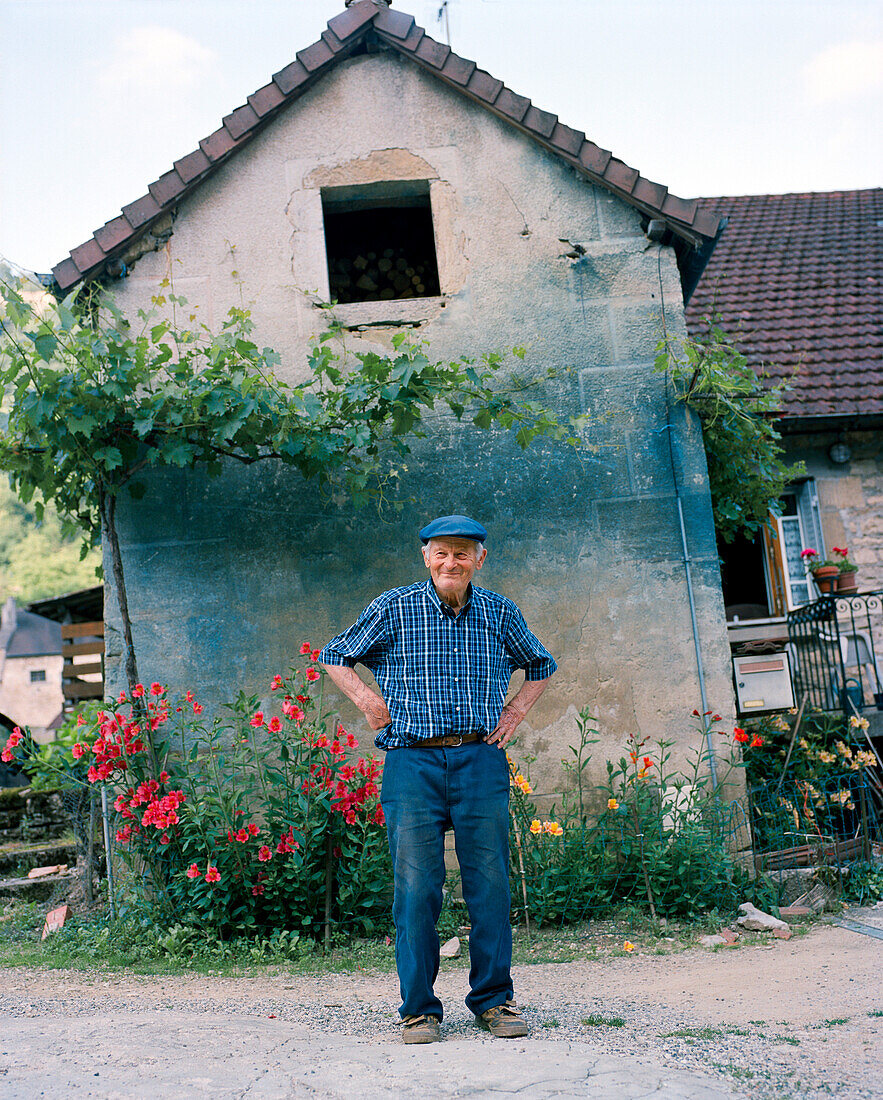 FRANCE, Baume les Messieurs, a local Frenchman in front of his home in the village, Jura Wine Region