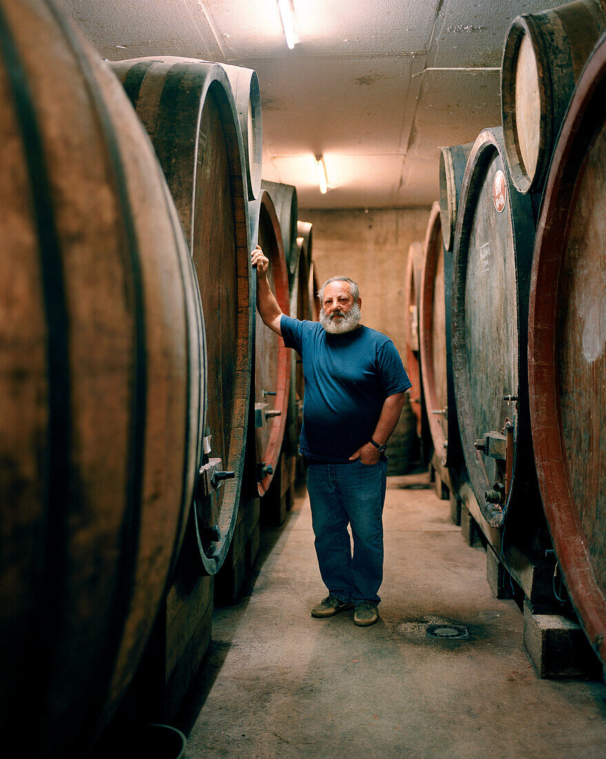 FRANCE, Montigny-les-Arsures, Arbois, Jacques Puffeney stands in his barrel room, Jacques Puffeney Winery, Jura Wine Region, Vin Jaune