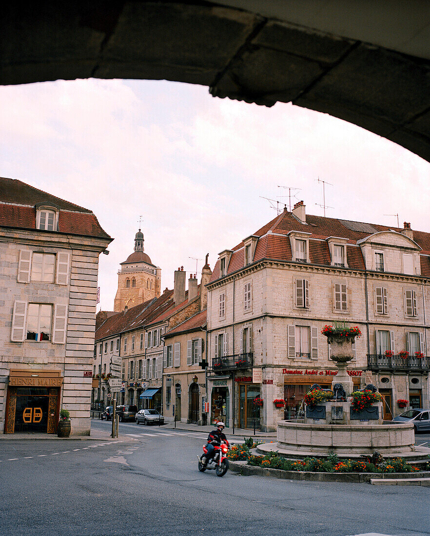 FRANCE, Arbois, man rides through Arbois on his motorcycle, Jura Wine Region