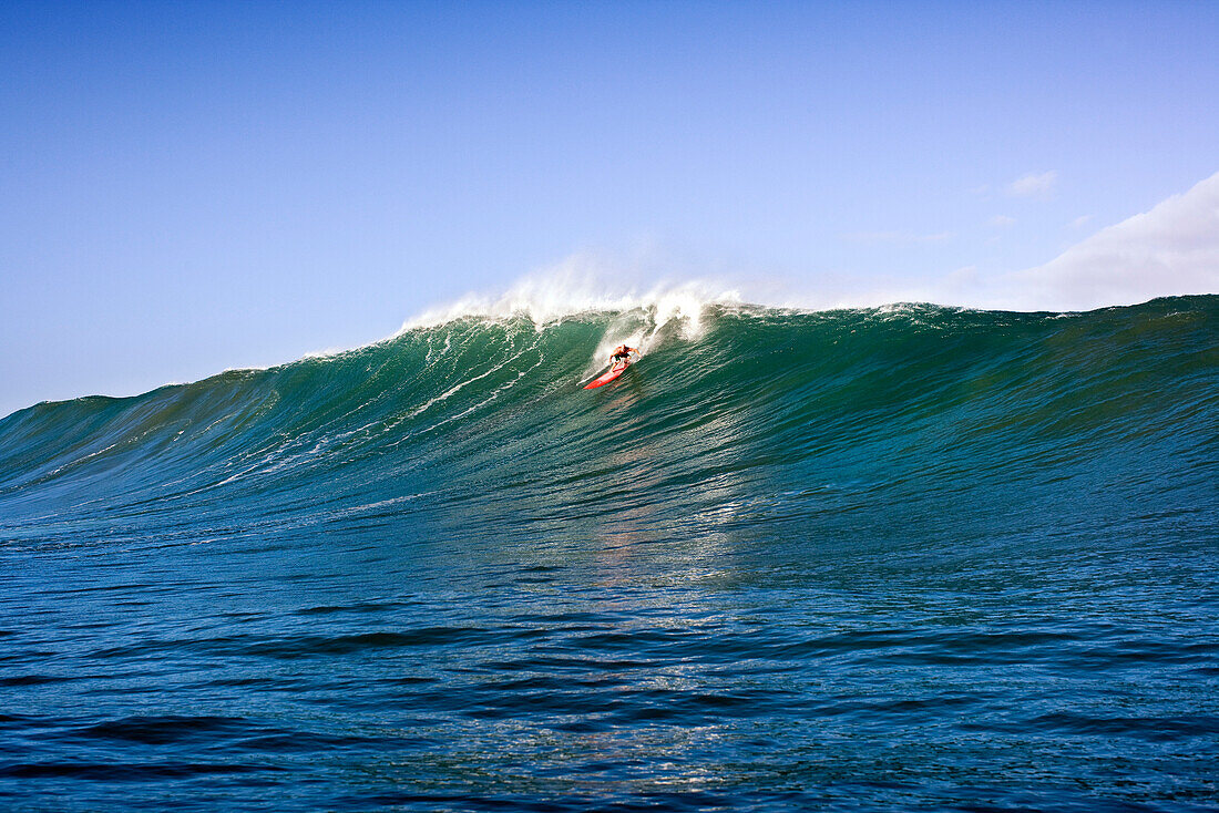 USA, Hawaii, man surfs a large wave on an outer reef, the North Shore of Oahu