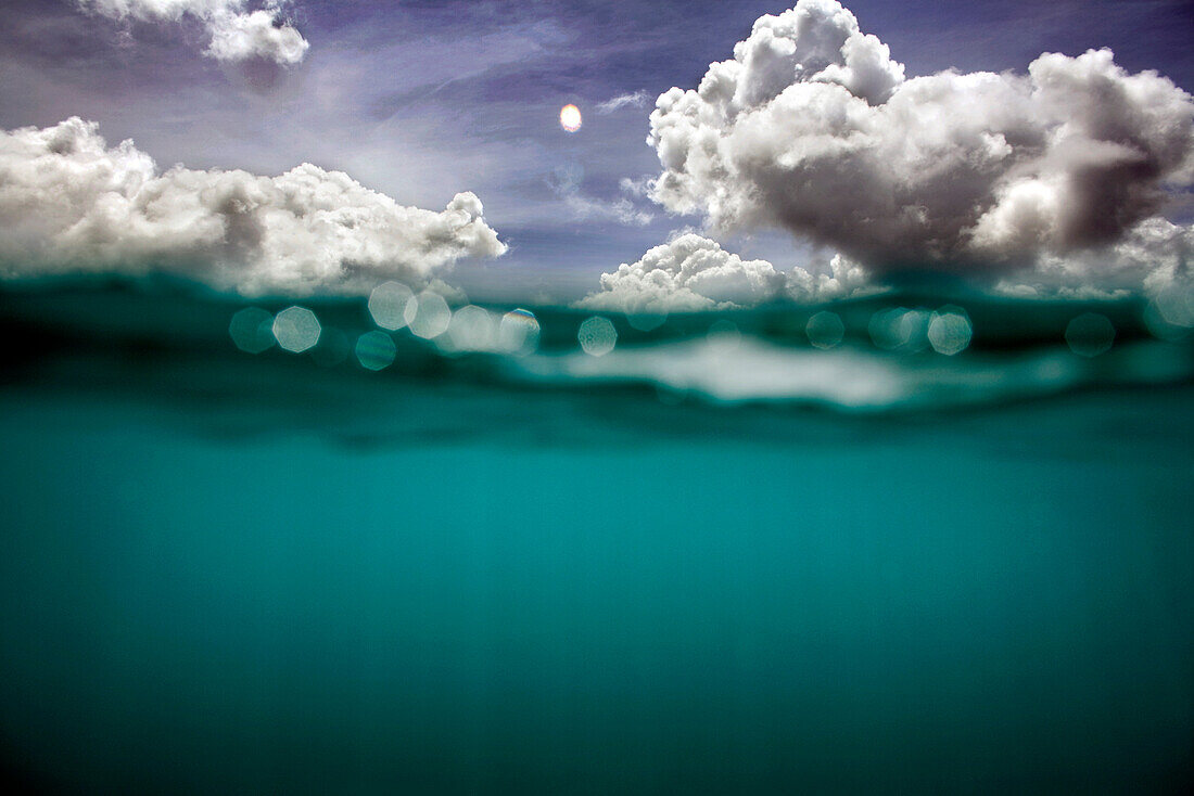 INDONESIA, Mentawai Islands, Kandui Surf Resort, half underwater and half sky and clouds, Indian Ocean