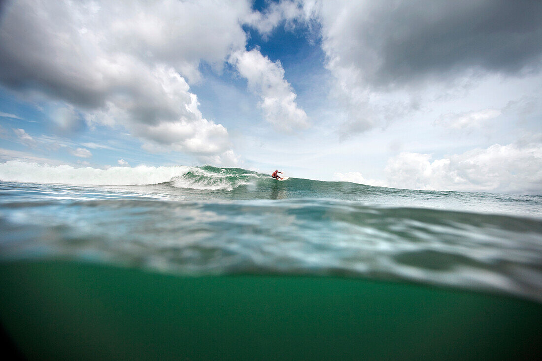 INDONESIA, Mentawai Islands, Kandui Resort, man surfing a wave called Beng Beng