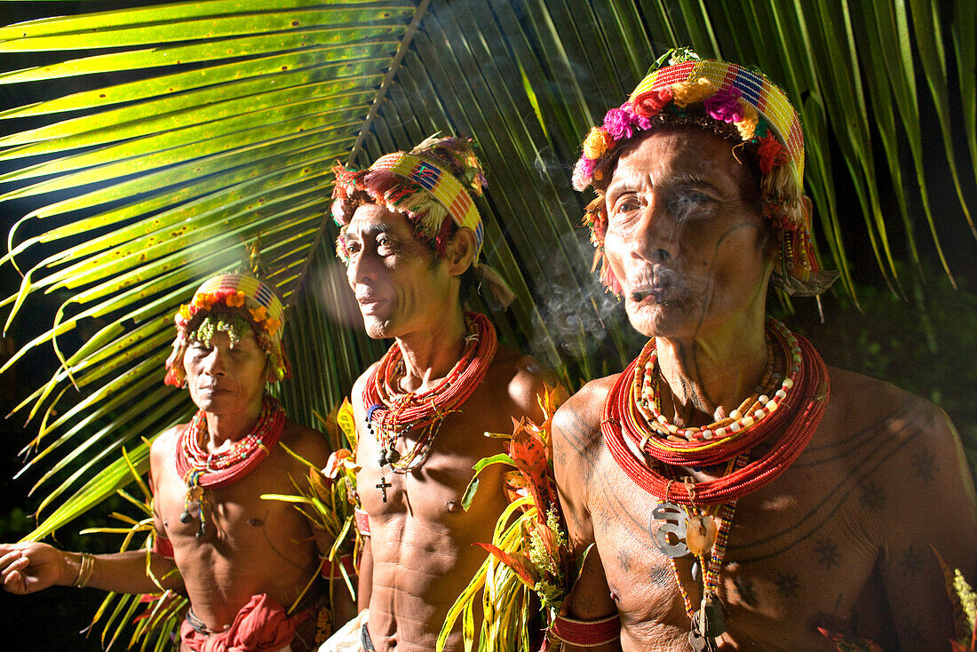 INDONESIA, Mentawai Islands, Kandui Resort, three tribal elders in traditional clothing