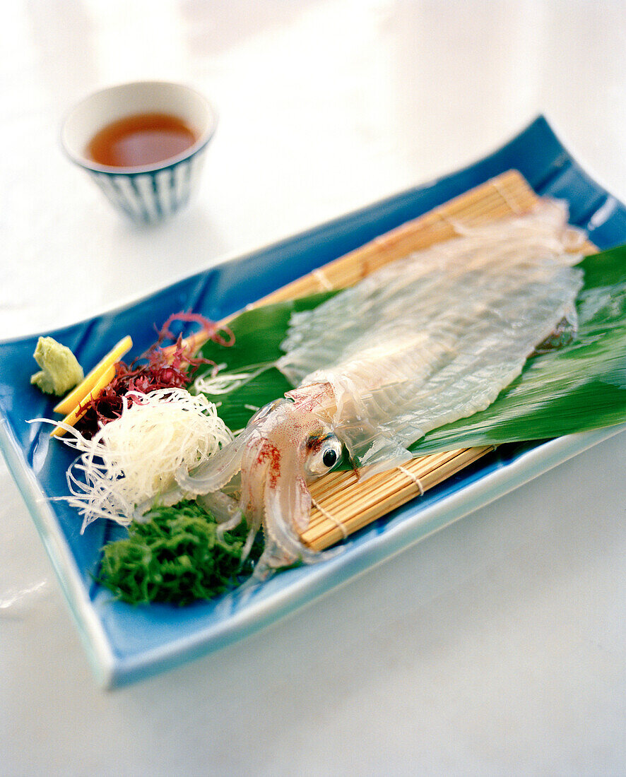JAPAN, Kyushu, live squid served on Karatsu Pottery, Kai Shu Restaurant