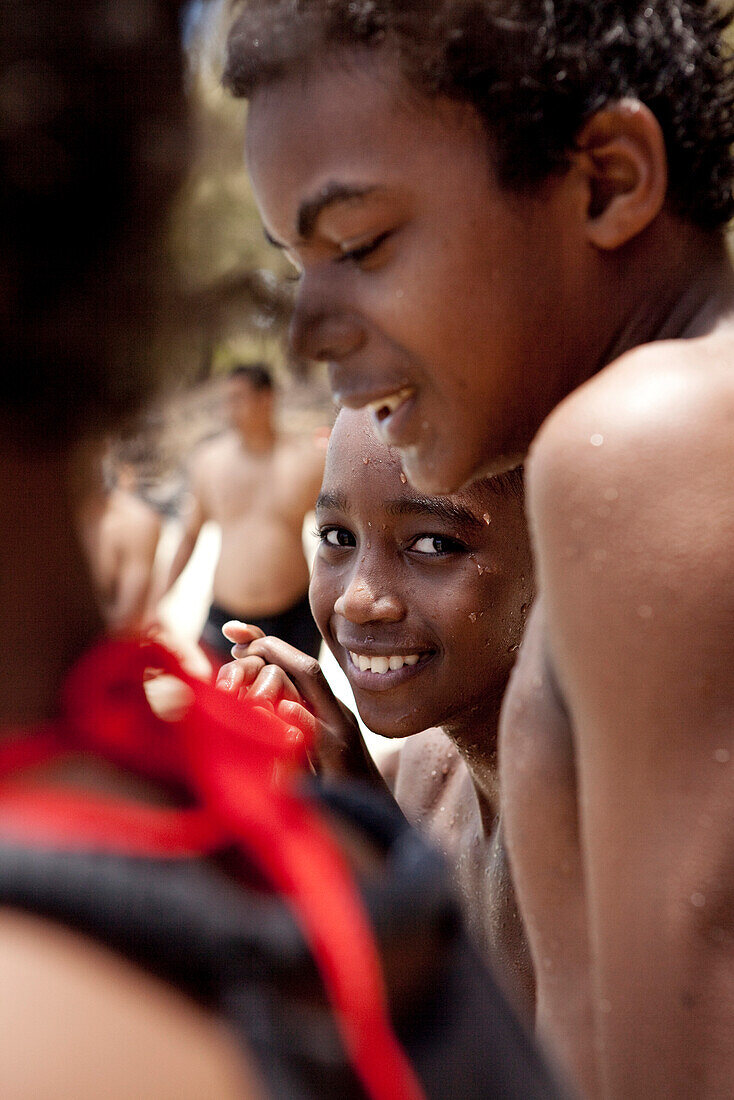 MAURITIUS, boys on the beach at Ile aux Cerfs Island