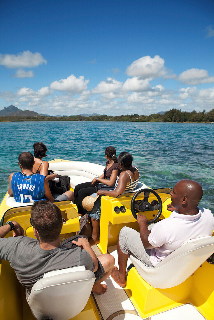 MAURITIUS, boat tour in an area called Iles aux Marginey, Quatre Soeurs Mountain in the distance