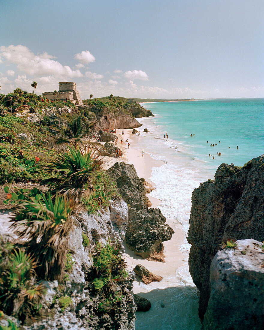 MEXICO, Maya Riviera, Tulum Ruins and beach with swimmers