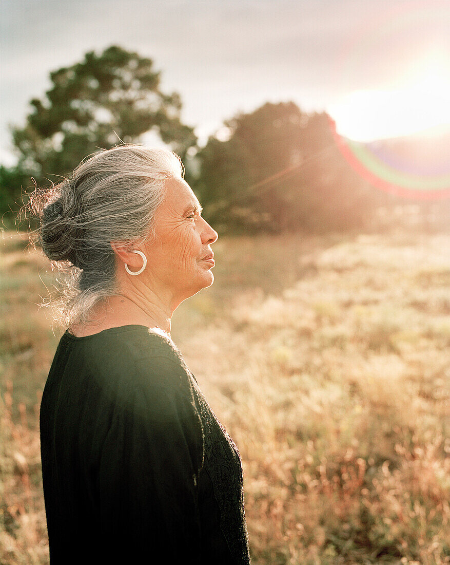 USA, New Mexico, beautiful Native American woman at sunset, Valley of the Wild Roses