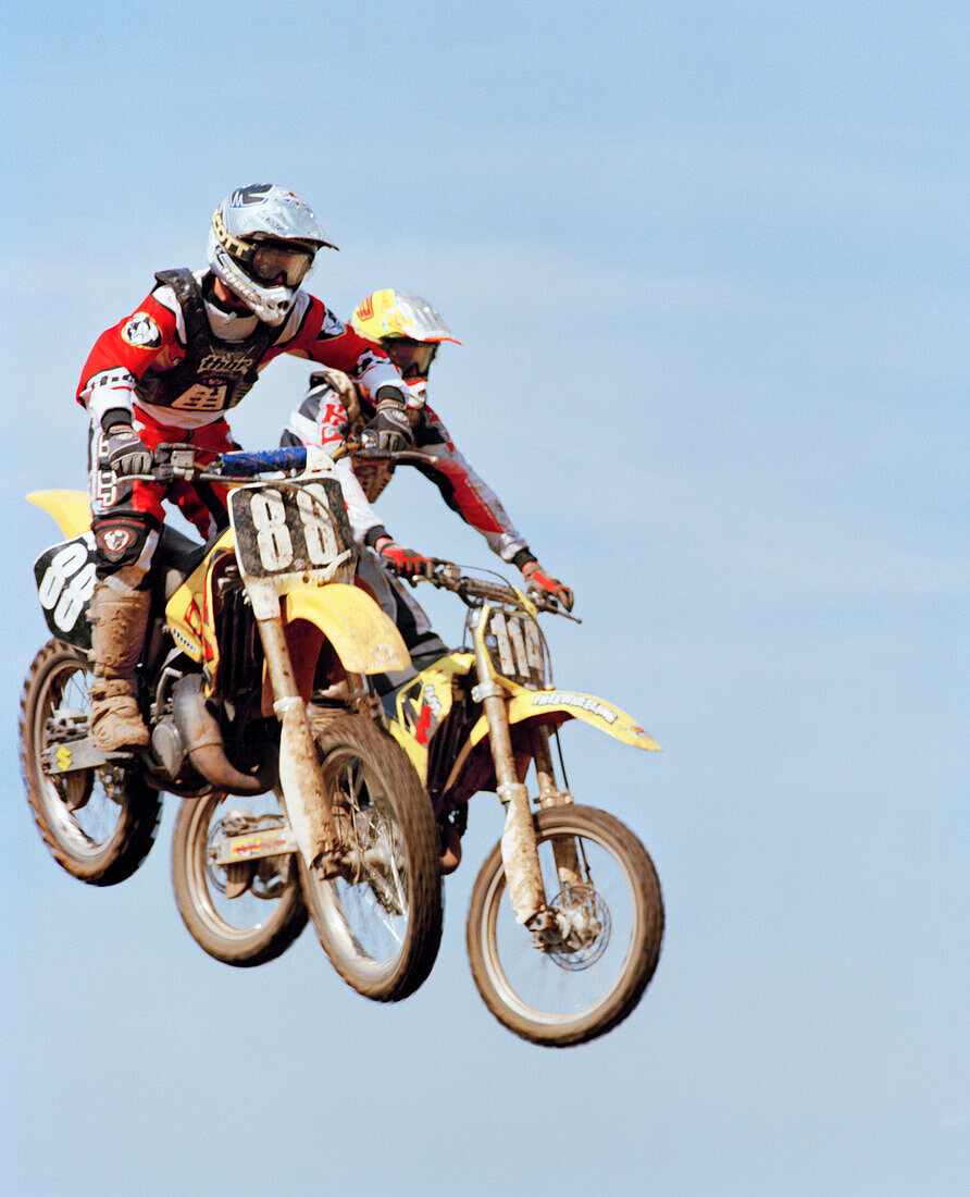 USA, Tennessee, motocross riders getting air and racing for the lead