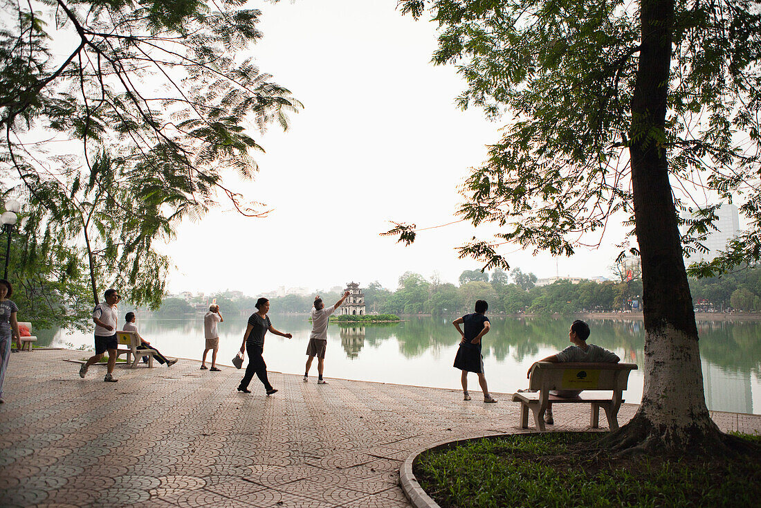 VIETNAM, Hanoi, VIETNAM, Hanoi, people stretch, exercise and walk early in the morning, Hoan Kiem Lake and Pagoda