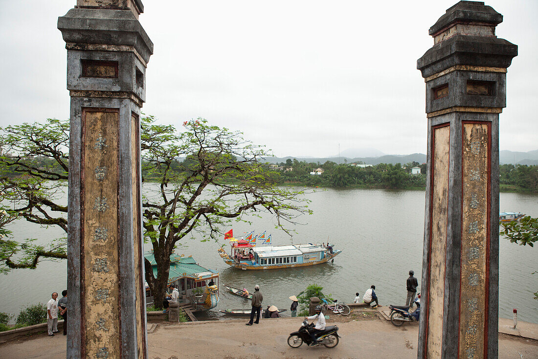 VIETNAM, Hue, a view of the Perfume river and historic Vietnamese architecture in front of an old monastery