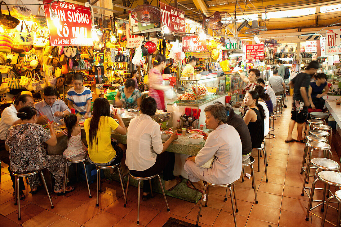 VIETNAM, Saigon, Ben Thanh Market, people dine at one of the many small restaurants in the market, Ho Chi Minh City
