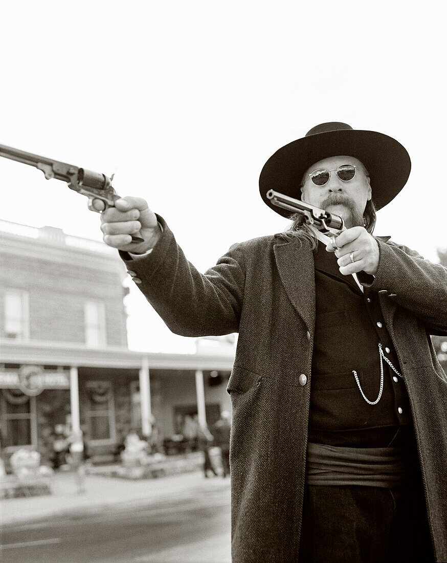 USA, Wyoming, mature man with his guns, Wild Bill Cody Shootout (B&W)