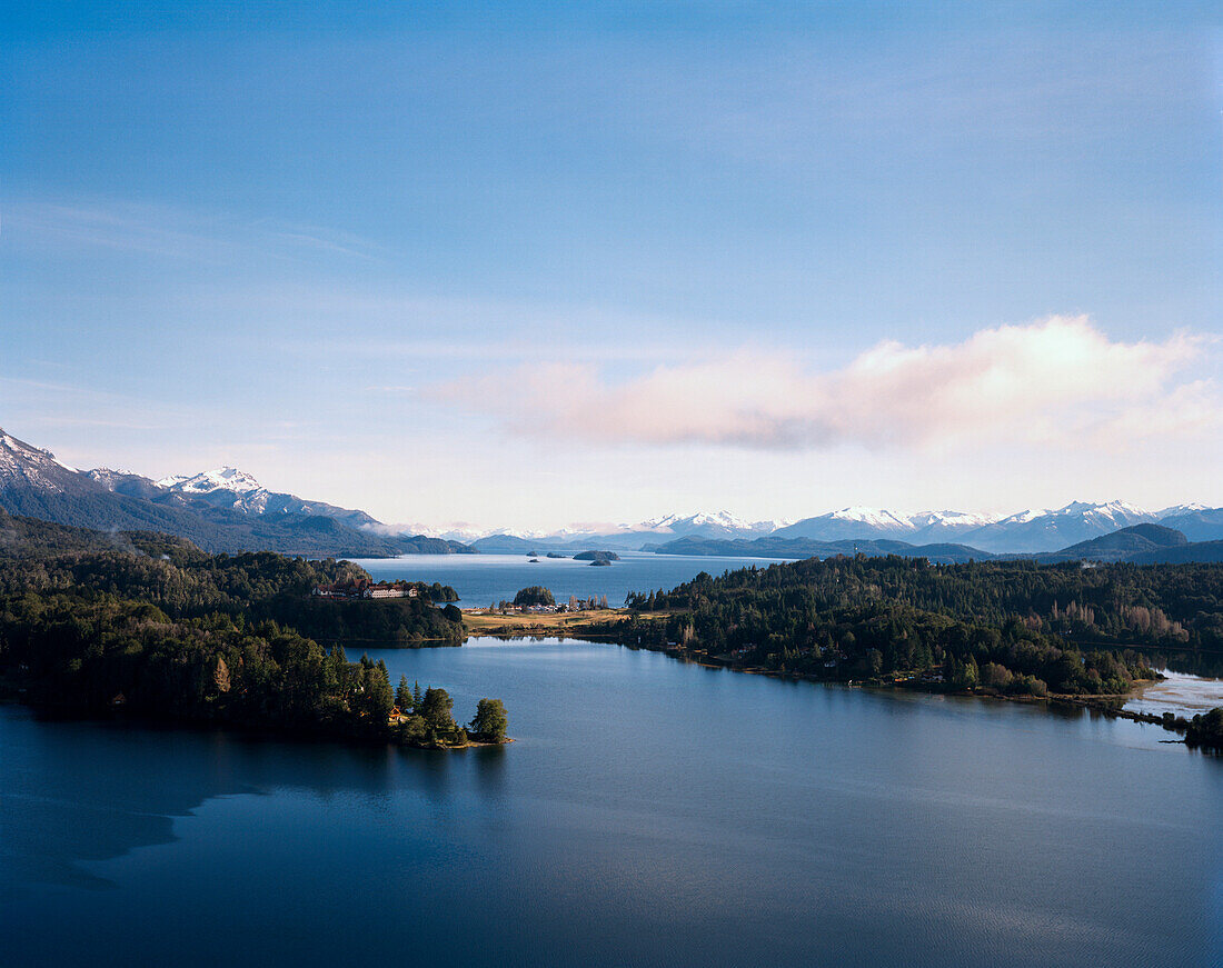 ARGENTINA, Patagonia, scenic view of the Llao Lao Lodge Hotel and the Nahuel Huapi Lake with mountains in the background