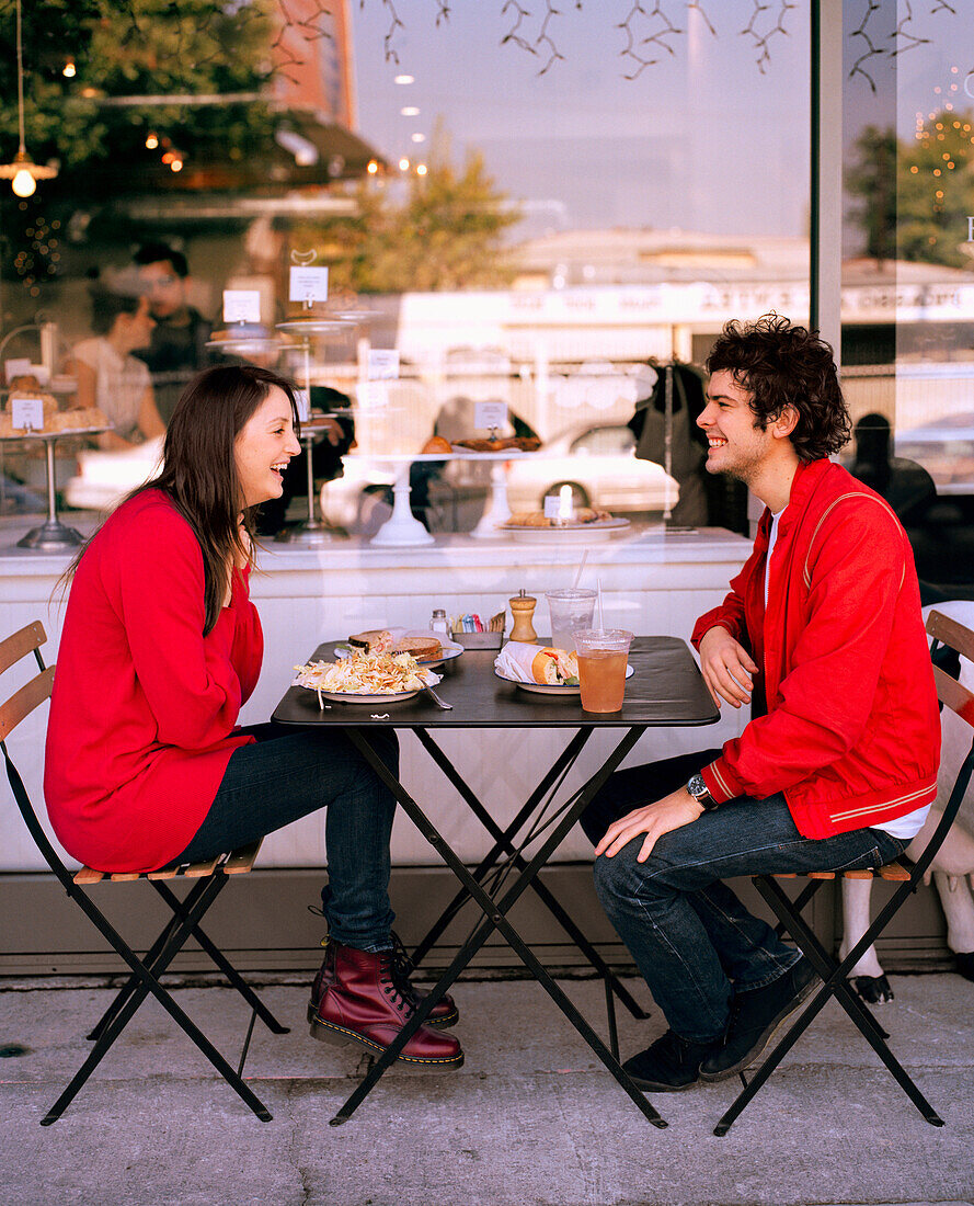 USA, California, Los Angeles, couple having breakfast at an outdoor table at Joan's On Third Cafe.