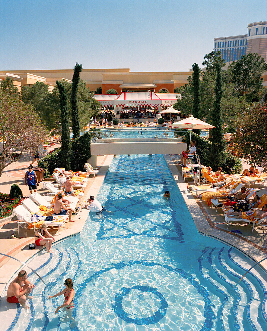 USA, Nevada, Las Vegas, people relaxing on pool of Wynn Las Vegas Hotel, elevated view
