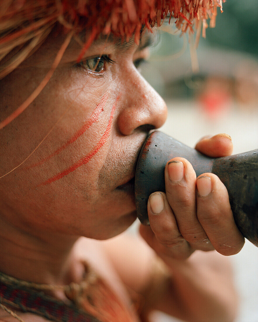 PERU, Amazon Rainforest, South America, Latin America, tribal man holding a blowgun. He is part of the Yagua Tribe.
