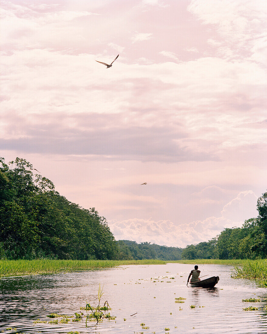 PERU, Amazon Rainforest, South America, Latin America, man on canoe in Yanayacu River