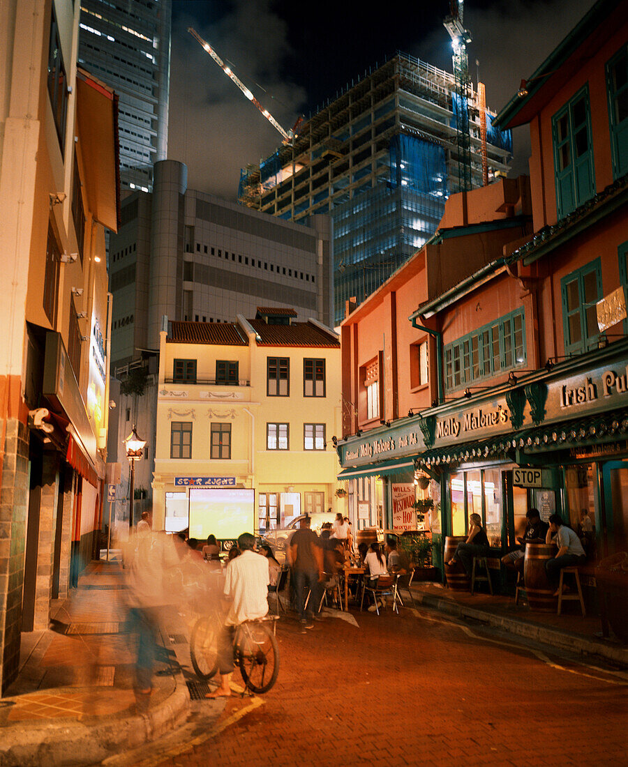 SINGAPORE, Boat Quay, tourists sitting in font of restaurant at night
