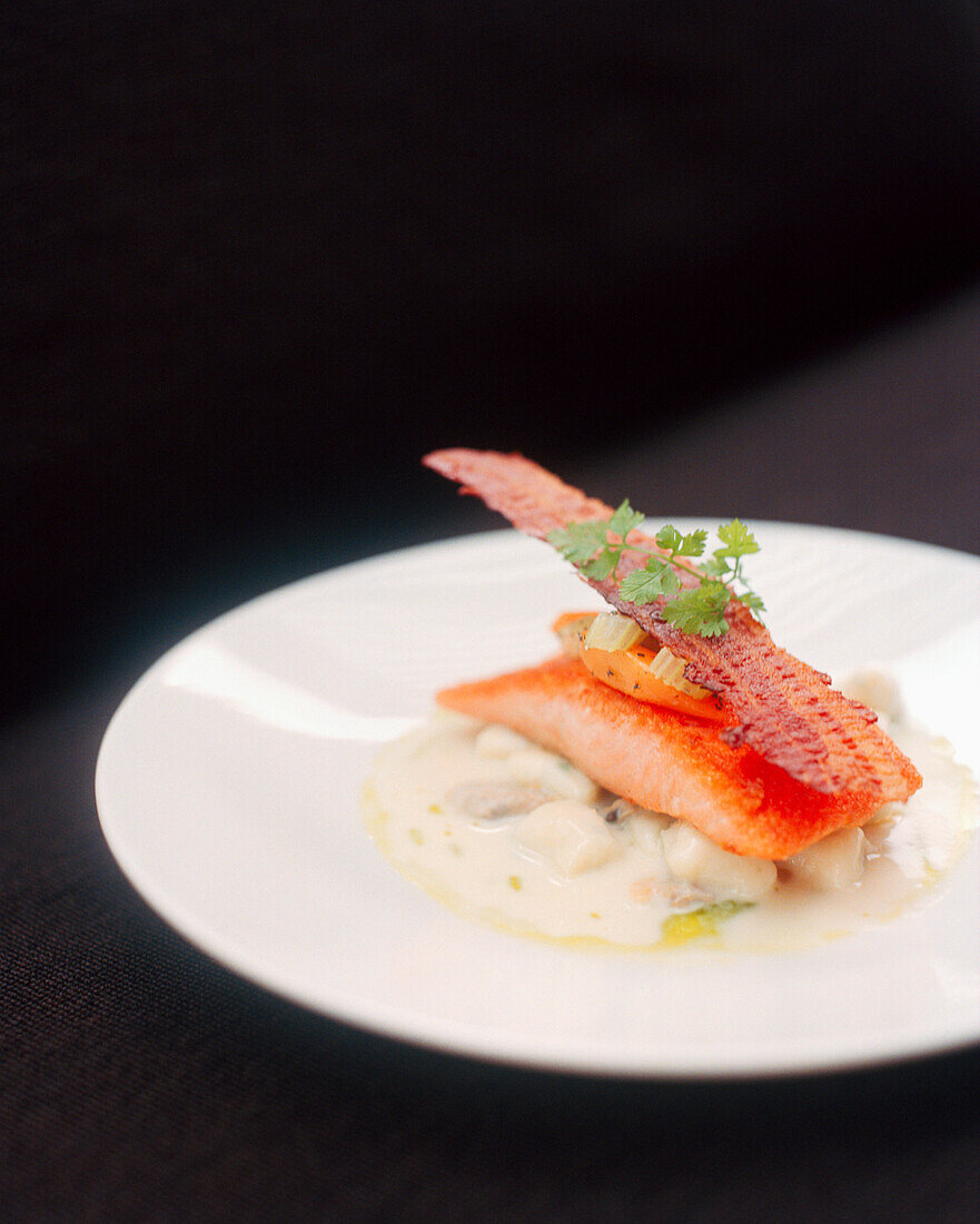 SINGAPORE, Asia, close-up of a pan seared ocean trout served in a plate at the Sentosa Resort Restaurant.