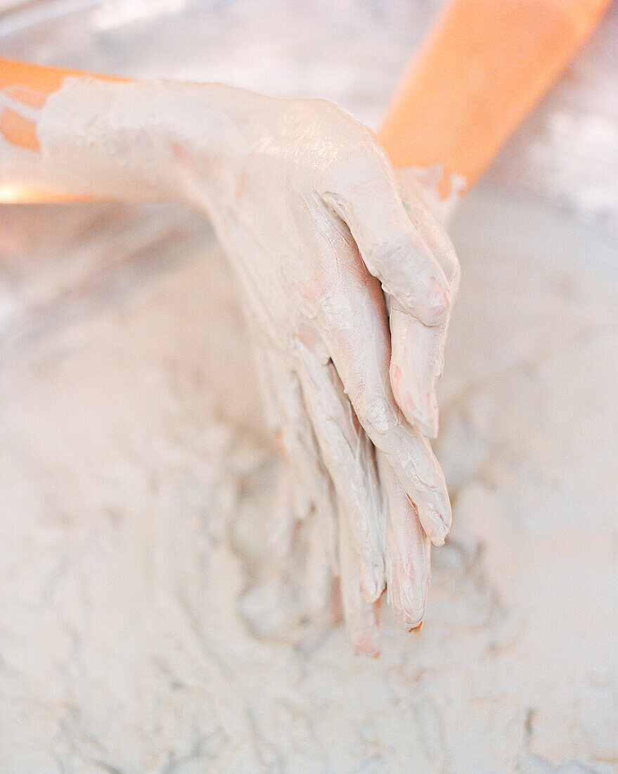 SINGAPORE, Asia, close-up of muddy human hands at Sentosan Spa