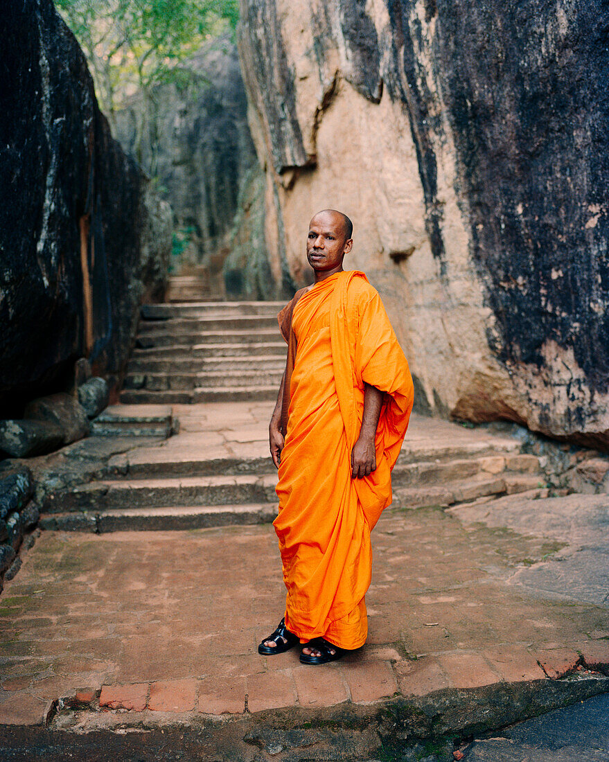 SRI LANKA, Asia, portrait of a Monk man standing at Sigiriya