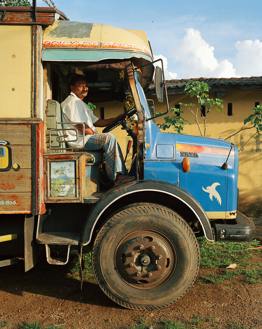 SRI LANKA, Asia, portrait of a driver sitting in truck